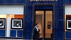 A passer-by walks past a Chaumet jewellery store located close to the Champs-Elysee avenue in central Paris, on July 27, 2021. 