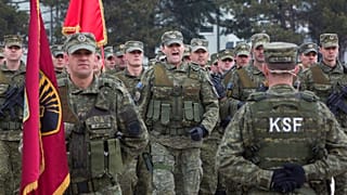 FILE: Members of the Kosovo Security Force (KSF) take part in a ceremony honouring a Kosovo Liberation Army commander, Pristina, Monday, March 5, 2018.