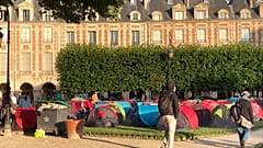Homleless people in tents on the Place des Vosges in Paris on the morning of July 30, 2021.