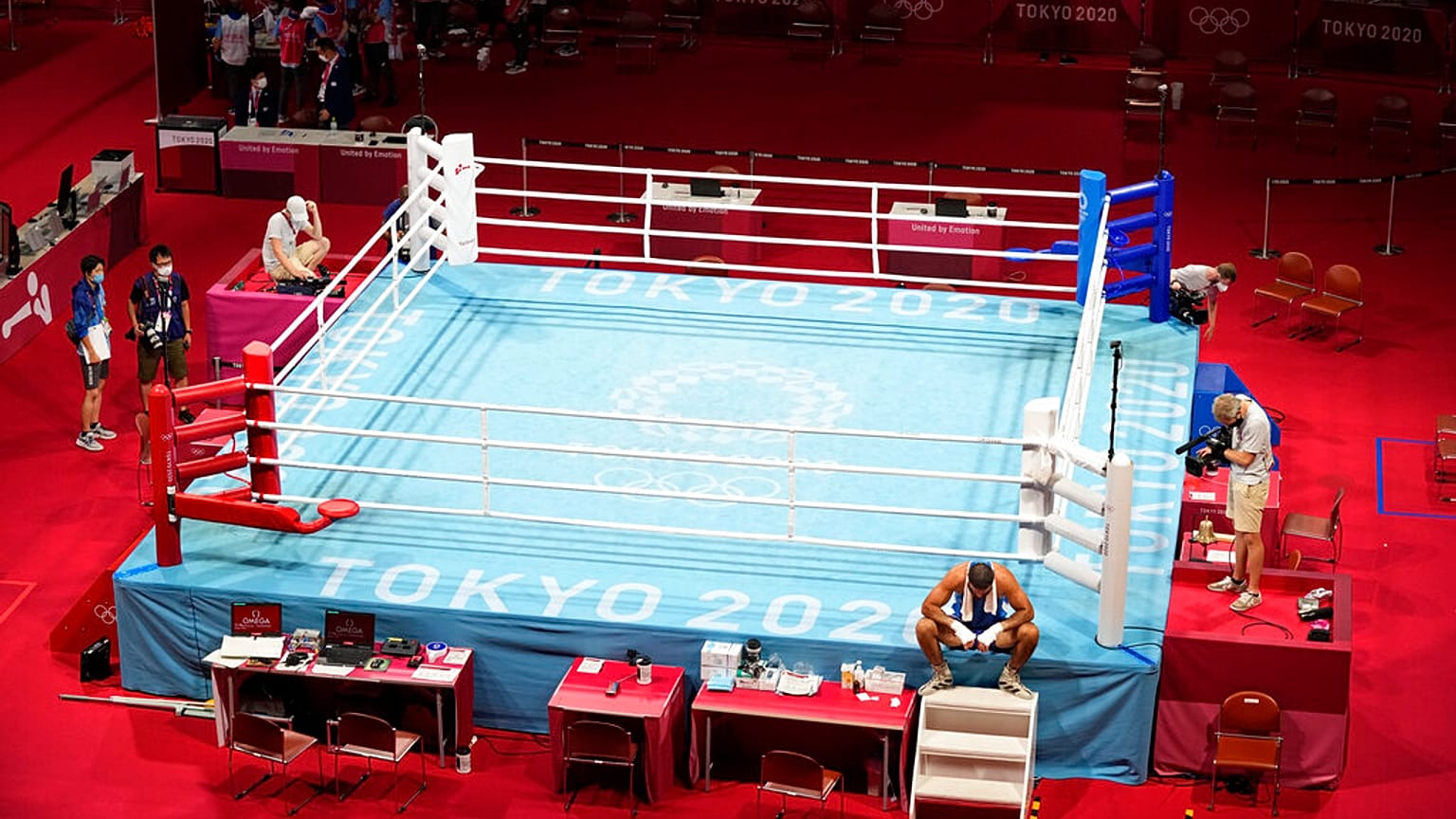 Eliad Mourad, of France refuses to leave the ring after losing a men's super heavyweight over 91-kg boxing match against Britain's Frazer Clarke at the 2020 Summer Olympics.