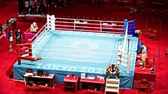 Eliad Mourad, of France refuses to leave the ring after losing a men's super heavyweight over 91-kg boxing match against Britain's Frazer Clarke at the 2020 Summer Olympics.