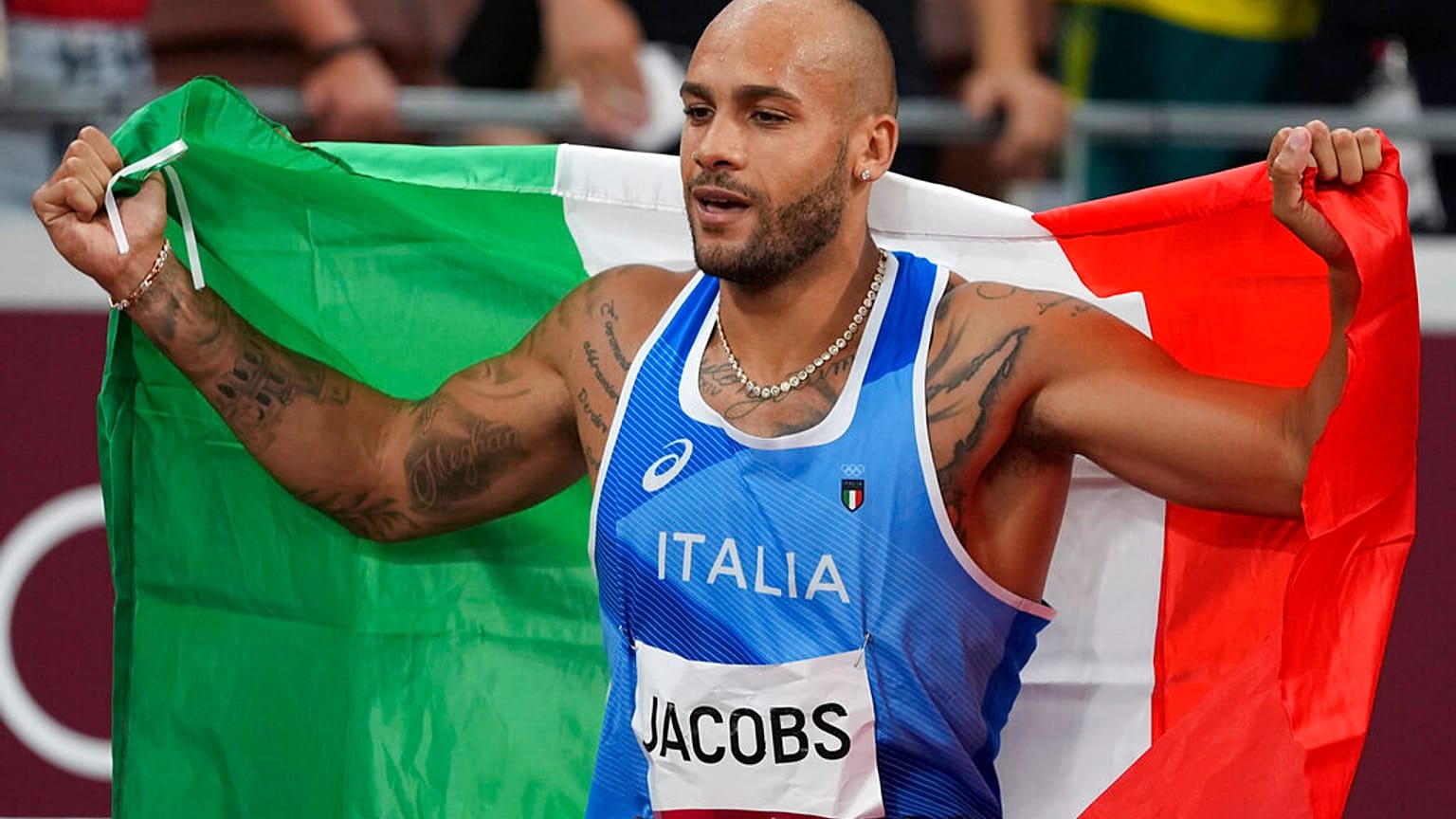Lamont Marcell Jacobs, of Italy, celebrates after winning the final of the men's 100-meters at the 2020 Summer Olympics, Sunday, Aug. 1, 2021, in Tokyo. 