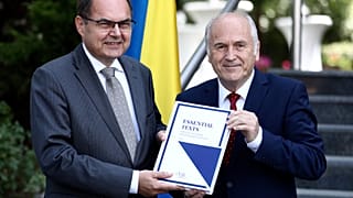 Christian Schmidt, new head of Bosnia's Office of the High Representative or OHR (L) with Valentin Inzko, during a ceremony Sarajevo, Bosnia, Aug. 2, 2021.