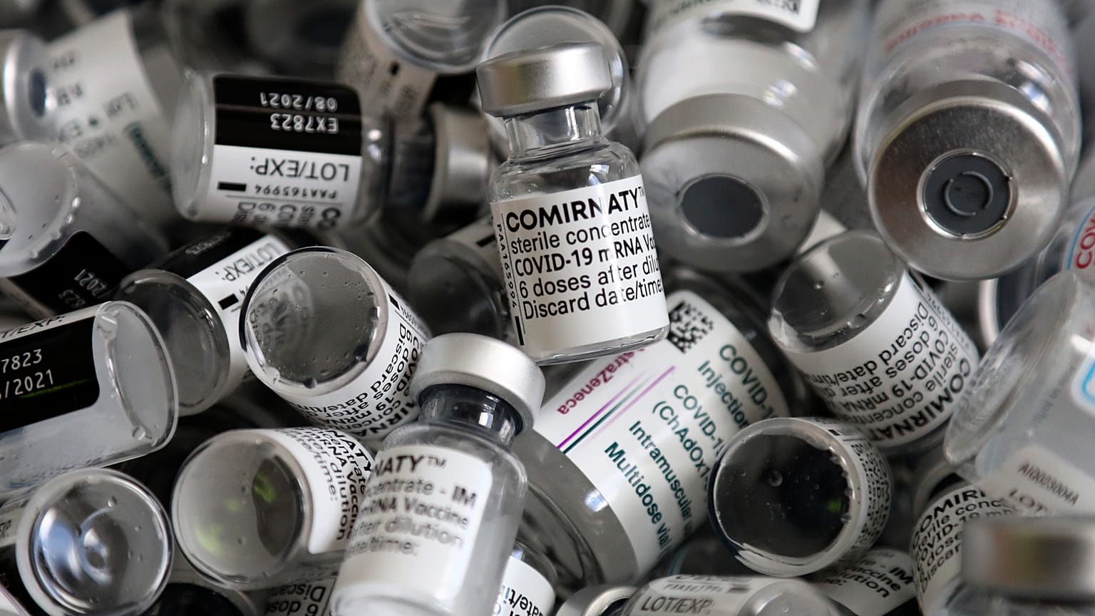 empty vials of the Pfizer-BioNTech COVID-19 vaccine lie in a box during a vaccine campaign at the Vaccine Village in Ebersberg near Munich, Germany, May 15, 2021.