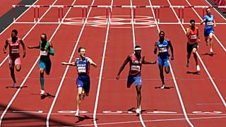 Karsten Warholm, of Norway, third left, celebrates as he wins the gold medal ahead of Rai Benjamin, of United States in the final of the men's 400-meter hurdles 
