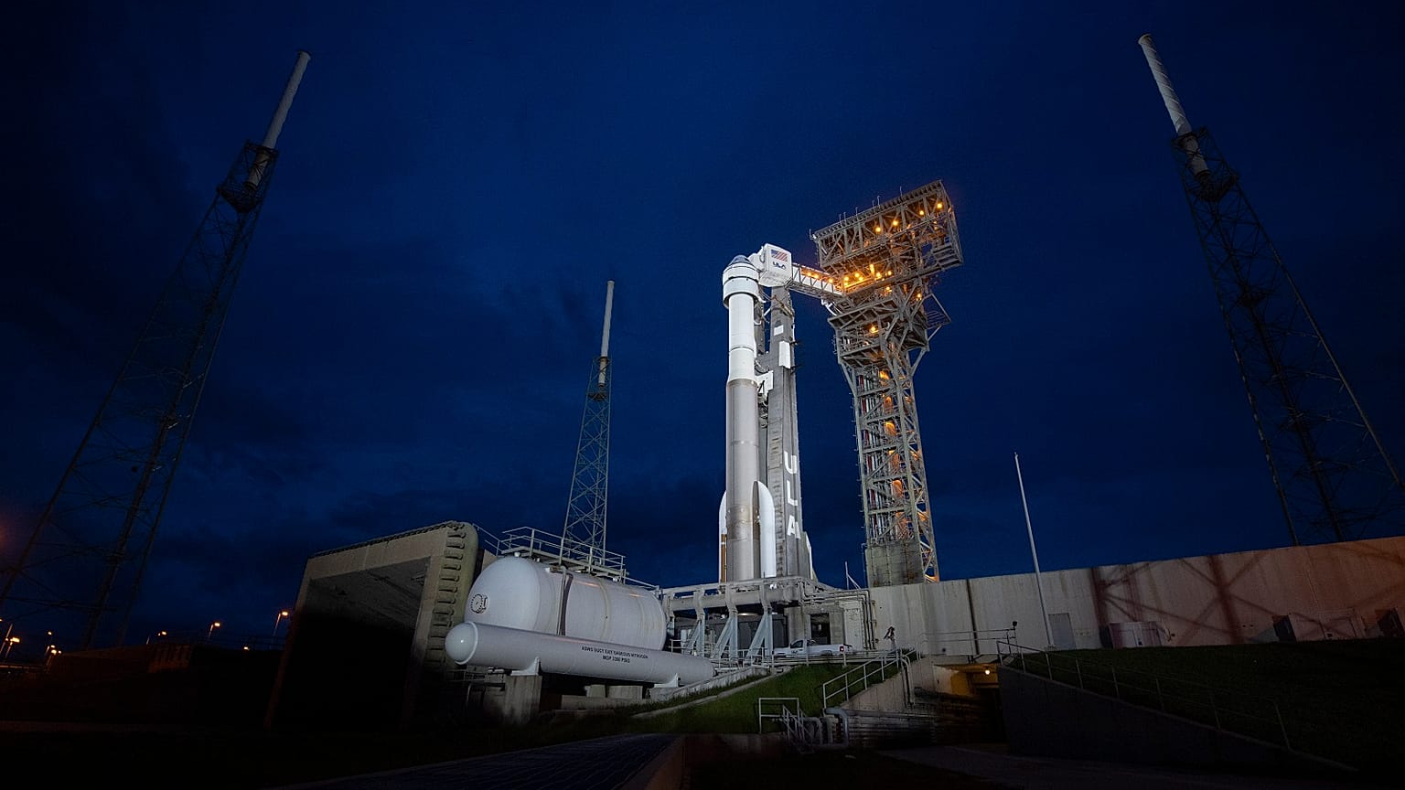 A United Launch Alliance Atlas V rocket with Boeing's CST-100 Starliner spacecraft aboard stands on the launch pad ahead of the Orbital Flight Test-2 mission.