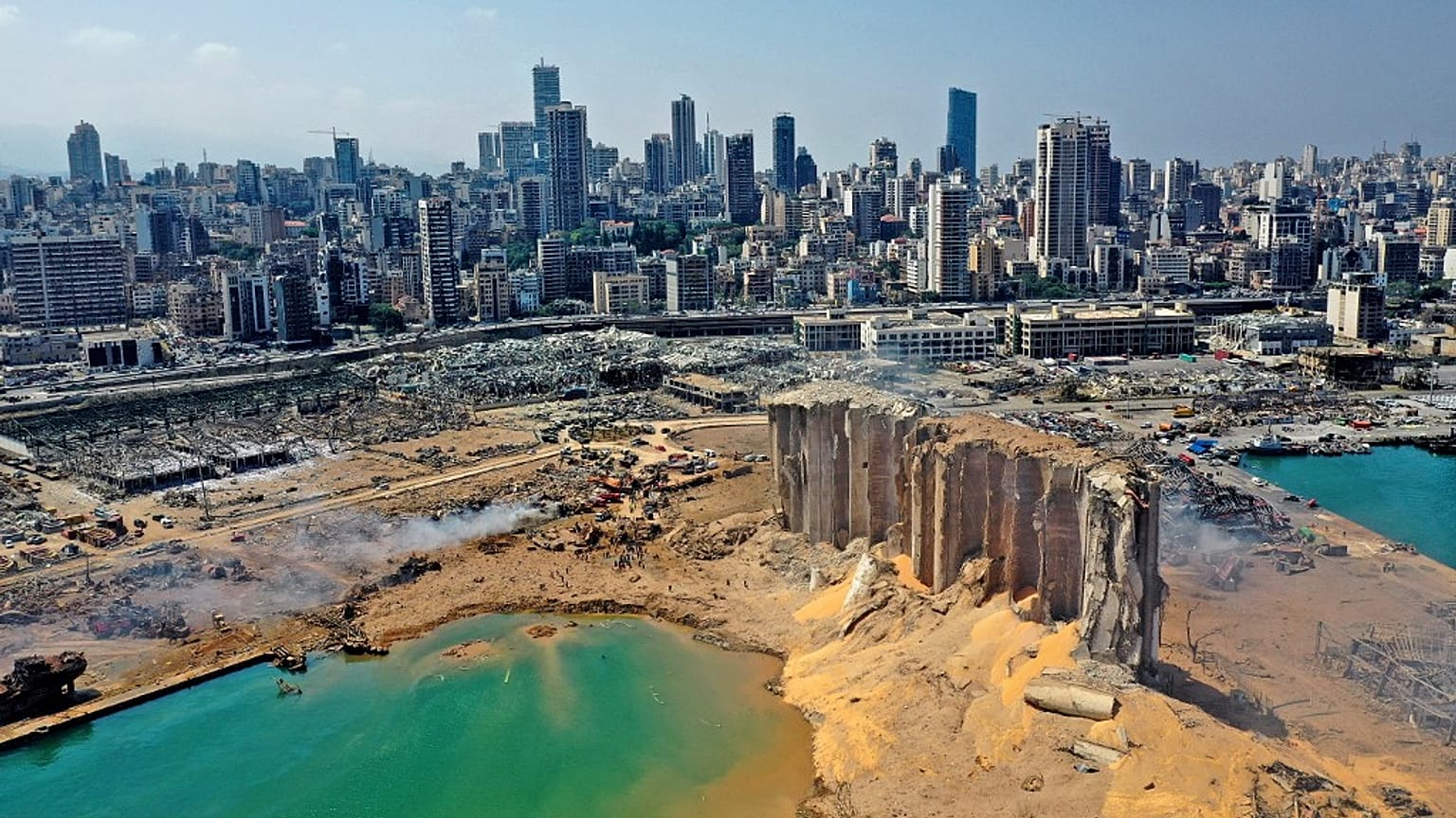 Aerial view of the massive damage at Beirut port's grain silos and the area around it, one day after the massive explosion on August 05, 2020.