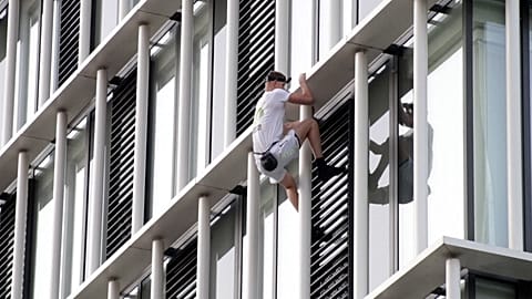 King-Thompson climbing the building