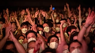 People take part in a music concert in Barcelona, Spain, Saturday, March 27, 2021. 