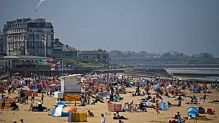 Sunbathers take advantage of the fine weather on the beach on the coast at Margate, east of London on May 31, 2021.
