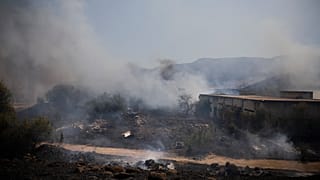 Fields burn following a hit by a rocket fired from Lebanon into Israeli territory, near the northern Israeli town of Kiryat Shmona, Wednesday, Aug. 4, 2021. 