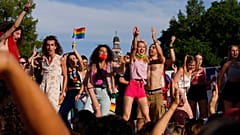 People take part in the annual Pride march, in Milan, Italy, Saturday, June 26, 2021