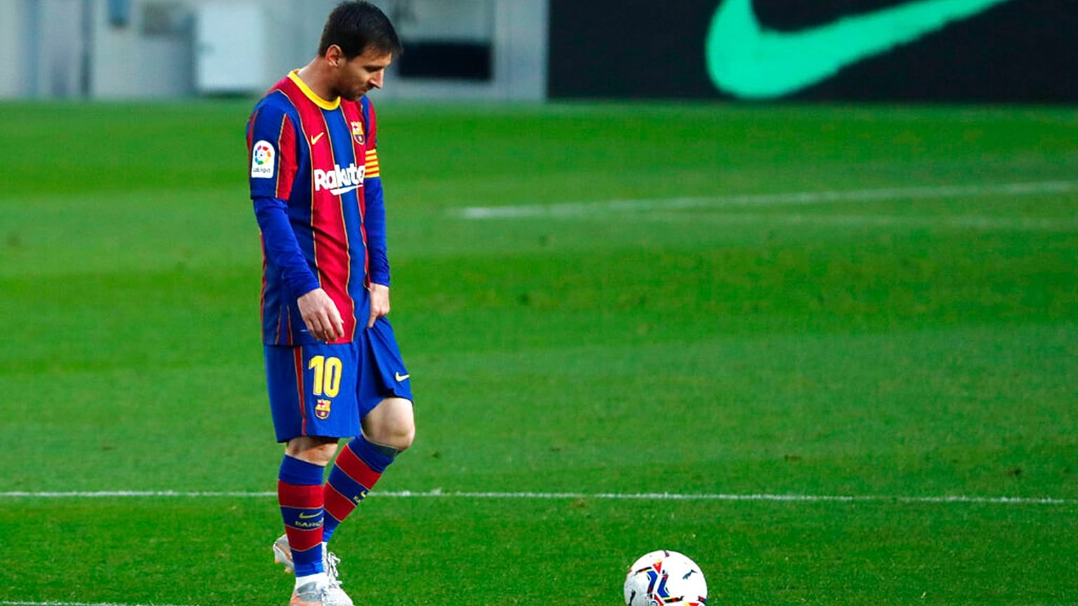 Barcelona's Lionel Messi reacts during the Spanish La Liga match against Granada at the Camp Nou stadium in Barcelona, Spain.