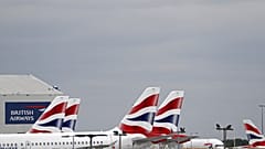 British Airways passenger planes are pictured at the apron at Heathrow Airport as the UK government's 14-day quarantine for international arrivals starts on June 8, 2020.