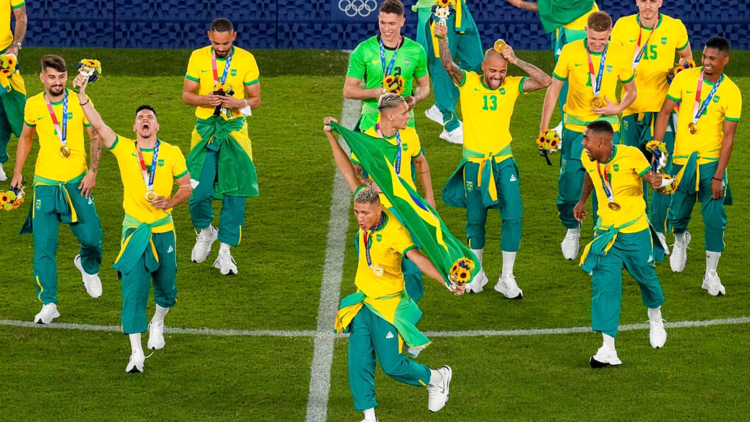 Played of Brazil celebrate after winning the gold medal defeating Spain 2-1 in the men's soccer final match
