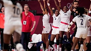 France's team players celebrate during the women's gold medal handball match against the Russian Olympic Committee at the Tokyo 2020 Summer Olympics, Aug. 8, 2021