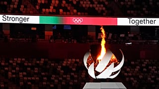The Olympic flame burns during the closing ceremony in the Olympic Stadium at the Tokyo 2020 Summer Olympics, Aug. 8, 2021