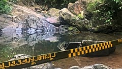 Police tape cordons off the area where a woman was found dead in Phuket, Thailand
