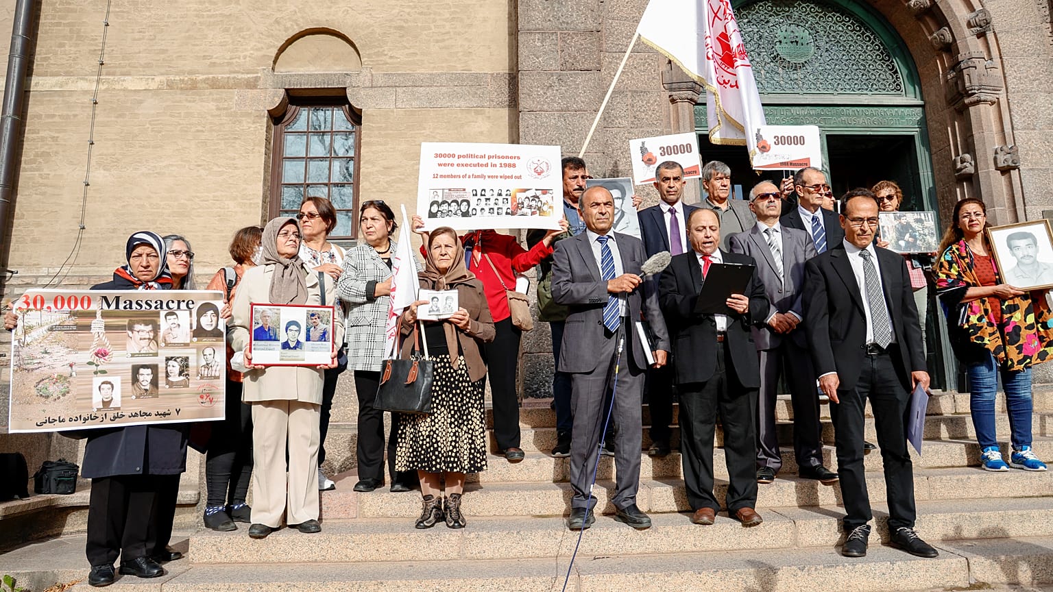 Supporters of the People's Mojahedin of Iran protest outside court.