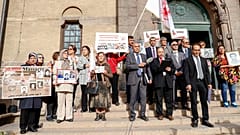 Supporters of the People's Mojahedin of Iran protest outside court.