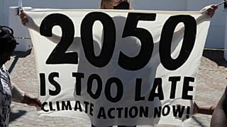Activists protest for climate justice outside parliament in Cape Town, South Africa,