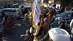 Taliban fighters are seen inside the city of Farah, capital of Farah province southwest of Kabul, Afghanistan