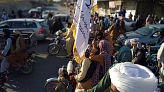 Taliban fighters are seen inside the city of Farah, capital of Farah province southwest of Kabul, Afghanistan
