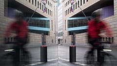 In this Jan.1, 2021 file photo a man rides a bike in front of the British embassy on New Year's Eve in Berlin, Germany. 
