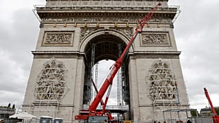 The Arc de Triomphe, home to the the tomb of the Unknown Soldier, being prepared before the wrapping of the monument, as part of a tribute for late bulgarian artist Christo.