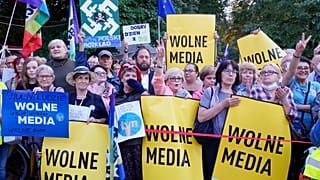 People demonstrate in defense of media freedom in Warsaw, Poland, on Tuesday, Aug. 10, 2021.