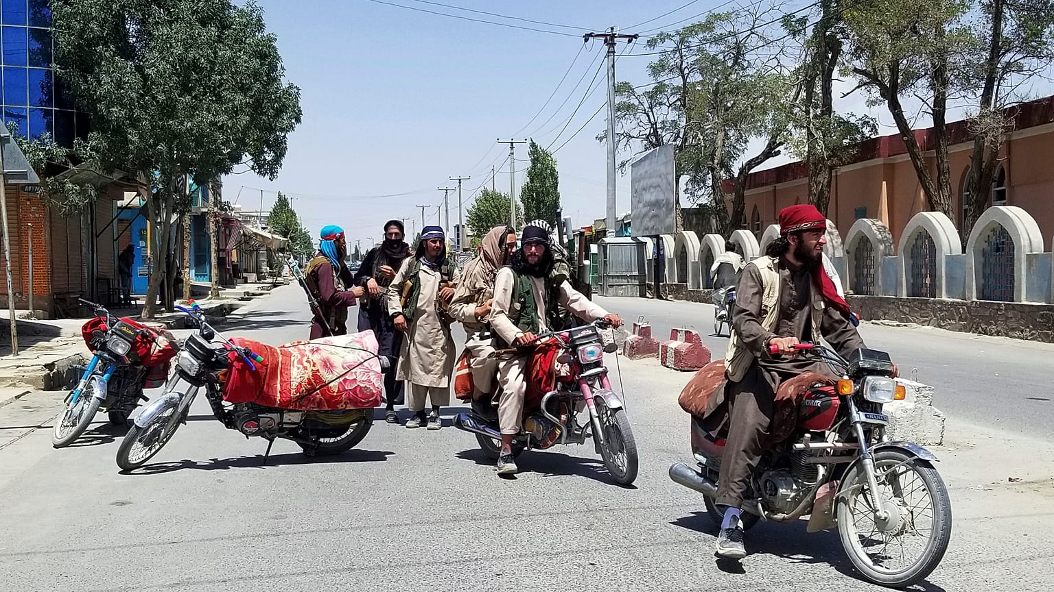Taliban fighters patrol inside the city of Ghazni, southwest of Kabul, Afghanistan, Thursday, Aug. 12, 2021. 