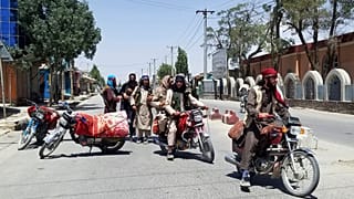 Taliban fighters patrol inside the city of Ghazni, southwest of Kabul, Afghanistan, Thursday, Aug. 12, 2021. 