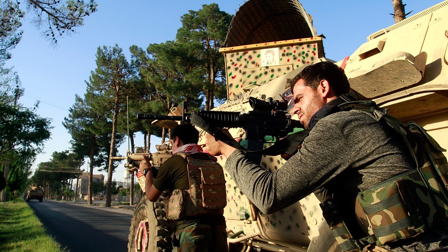 Afghan security personnel take a position during fighting between Taliban and Afghan security forces in Herat province, west of Kabul, Afghanistan on Aug. 3, 2021.
