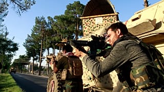 Afghan security personnel take a position during fighting between Taliban and Afghan security forces in Herat province, west of Kabul, Afghanistan on Aug. 3, 2021.