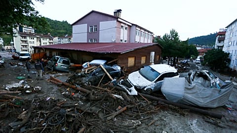 Destroyed cars in a street after floods and mudslides in Bozkurt town of Kastamonu province.