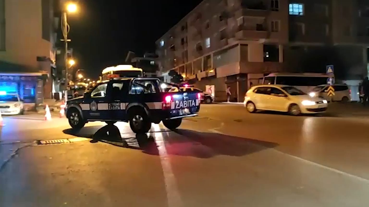 A police car patrols through Ankara's Altindag neighbourhood after the violence.