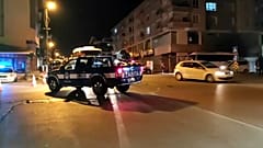 A police car patrols through Ankara's Altindag neighbourhood after the violence.