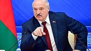 Belarusian President Alexander Lukashenko gestures while speaking during an annual press conference in Minsk, Belarus, Monday, Aug. 9, 2021.