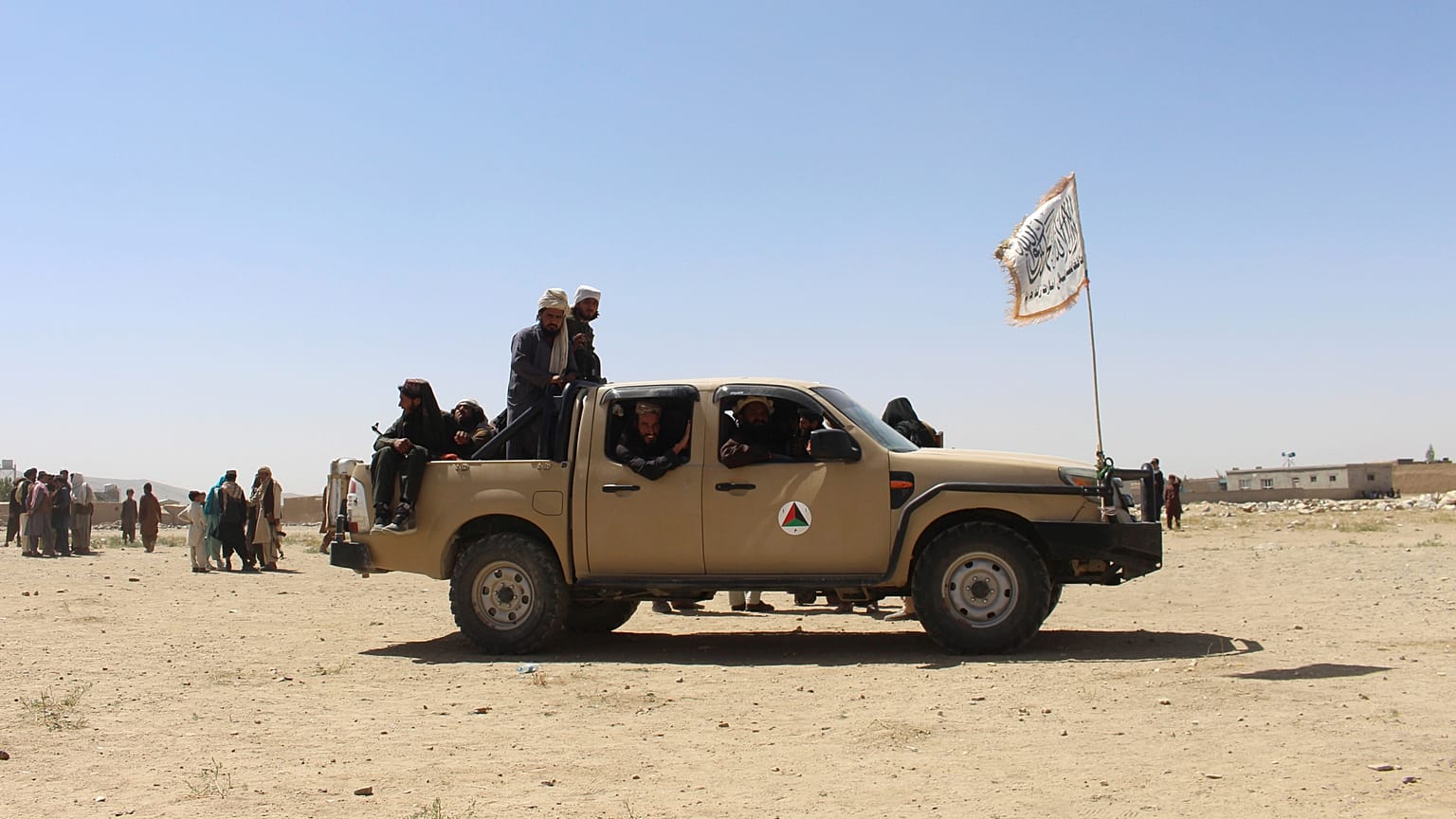 Taliban fighters patrol inside the city of Ghazni, southwest of Kabul