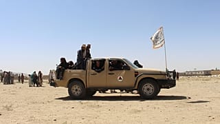 Taliban fighters patrol inside the city of Ghazni, southwest of Kabul