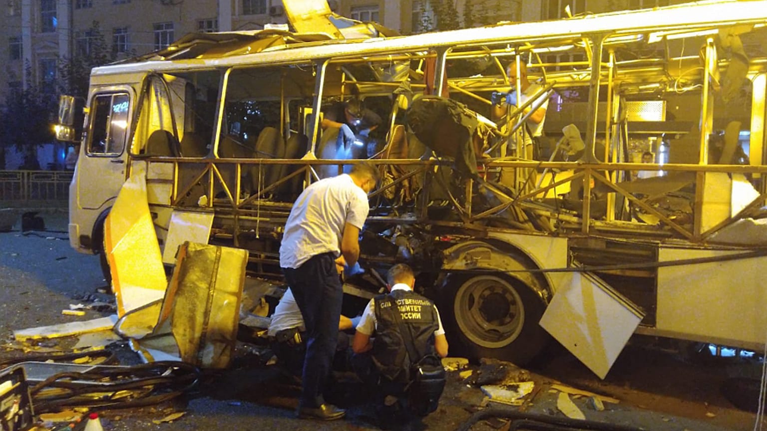 Investigators work at a site of a bus explosion in the town of Voronezh, August 13, 2021.