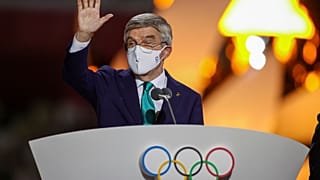 International Olympic Committee's President Thomas Bach waves during the closing ceremony in the Olympic Stadium at the 2020 Summer Olympics.