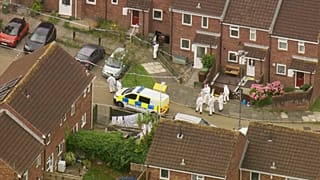 Investigators at the scene of the shooting