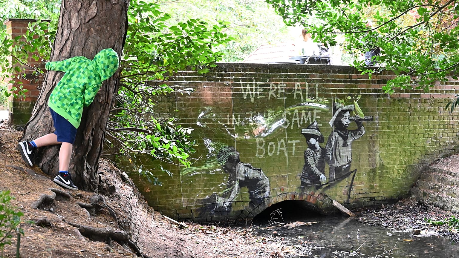 A graffiti artwork bearing the hallmarks of street artist Banksy on the wall of a bridge in Everitt Park in Lowestoft on the East coast of England