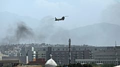A U.S. Chinook helicopter flies over the city of Kabul, Afghanistan, Sunday, Aug. 15, 2021. 