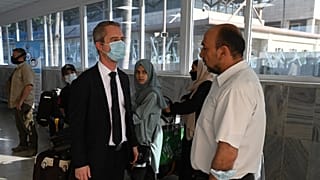 Ambassador David Martinon is pictured speaking with French embassy staff in July.