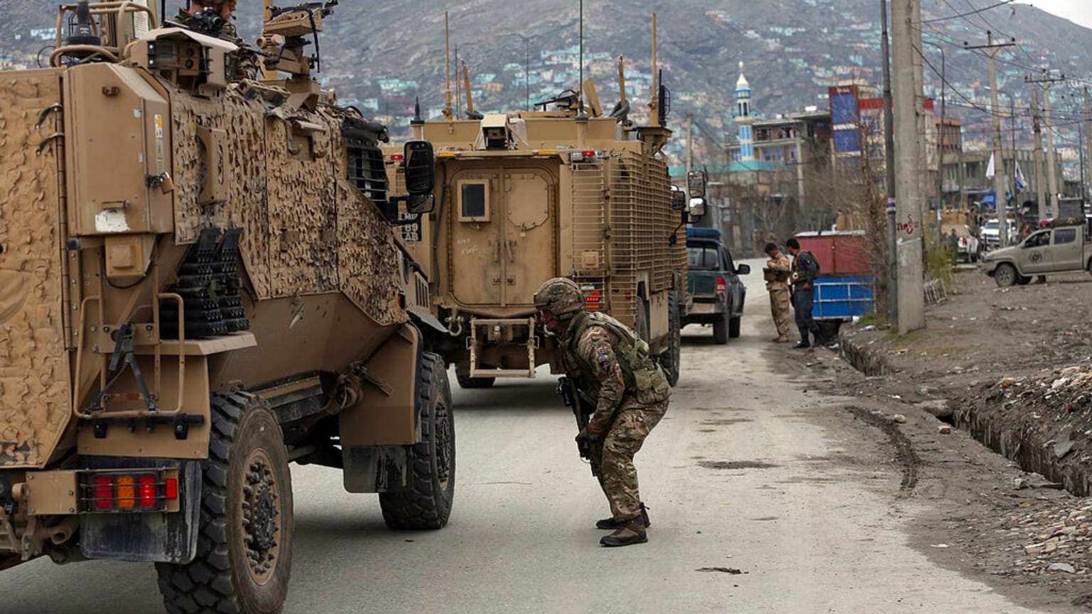 British soldiers with NATO-led Resolute Support Mission forces arrive at the site of an attack in Kabul, Afghanistan, Wednesday, March 25, 2020.