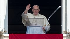 Pope Francis delivers his blessing as he recites the Angelus noon prayer from the window of his studio overlooking St.Peter's Square, at the Vatican, Aug. 15, 2021.