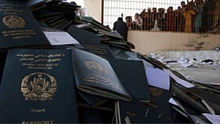 Afghans wait to collect their passports