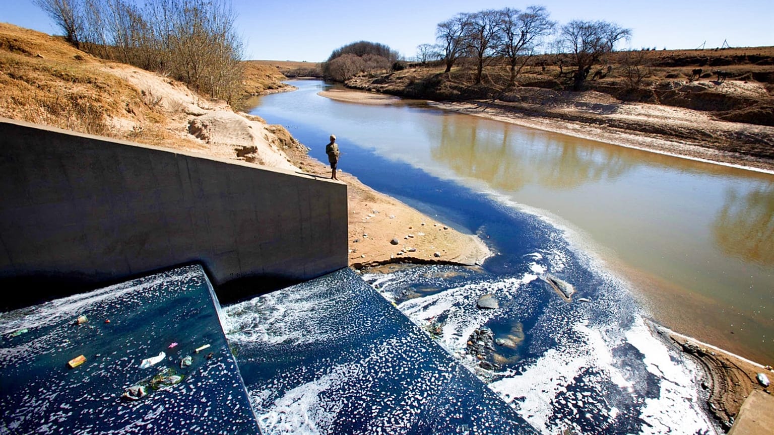 Blue dye from garment factories in Maseru, Lesotho is released into a river.  